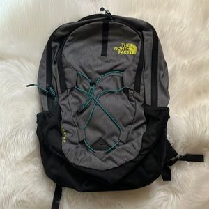 Black and gray north face backpack